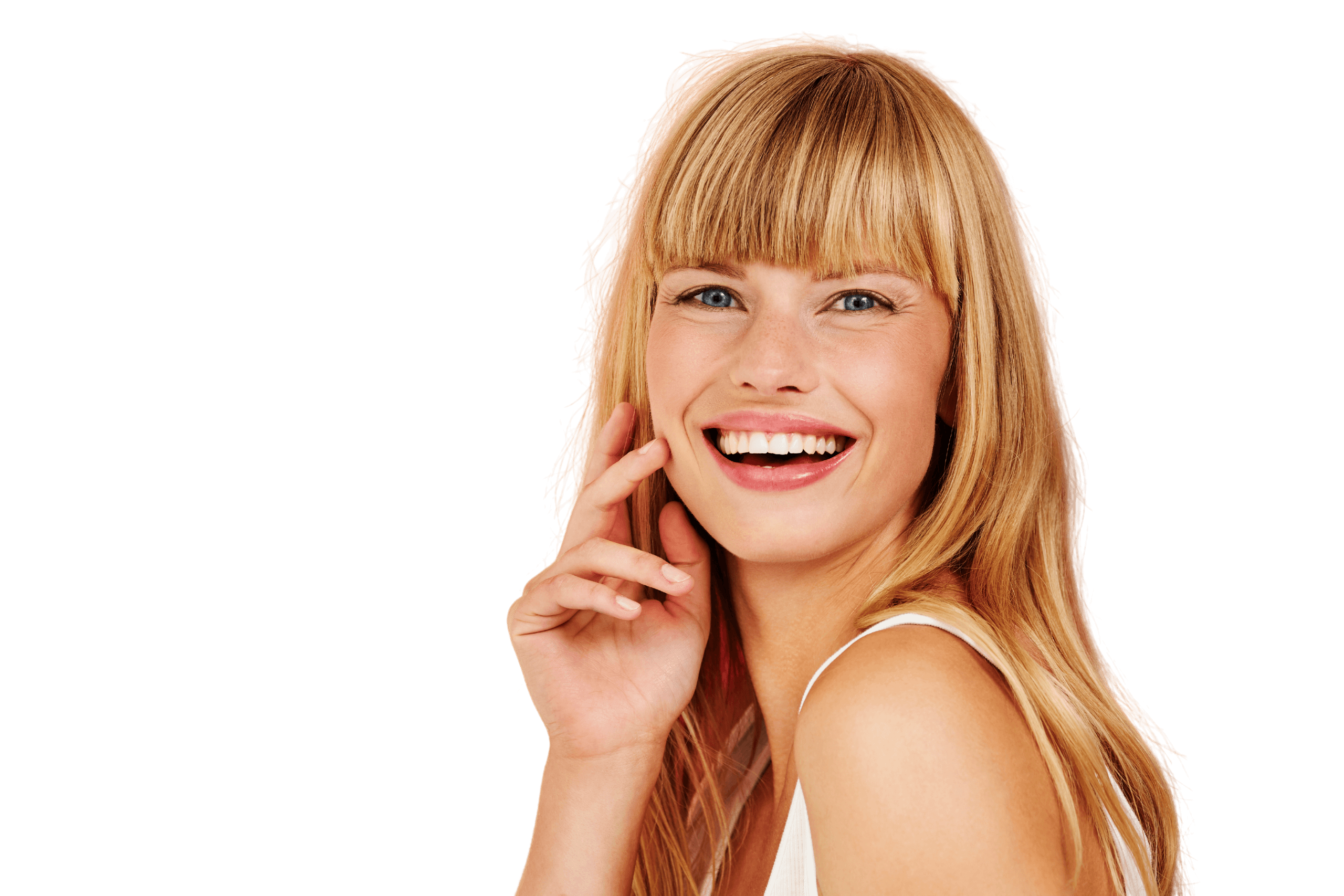 A pleasantly surprised woman in a green shirt smiles, appearing to be exclaiming something.